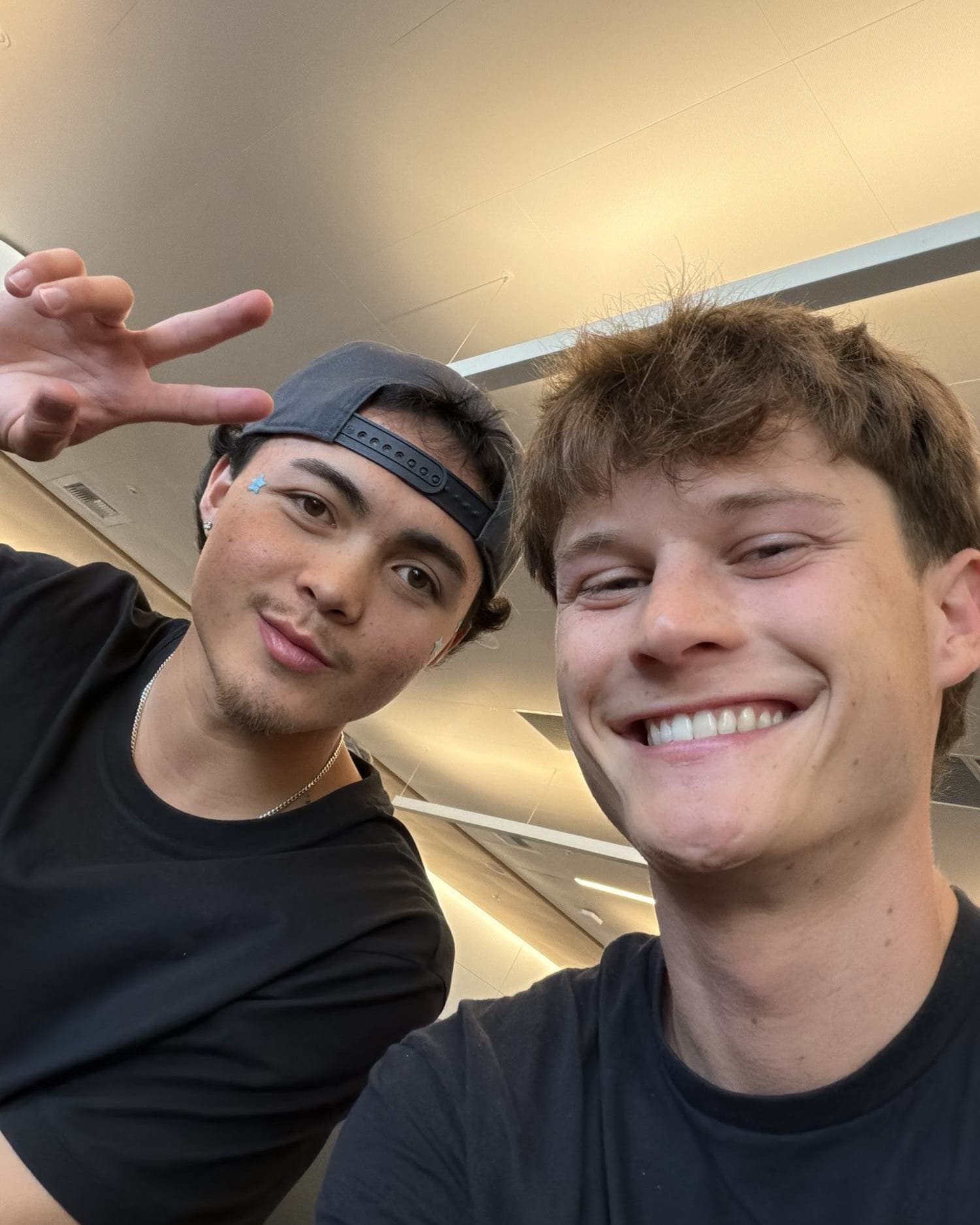 Two of the crew smiling on the standby flight to Iceland