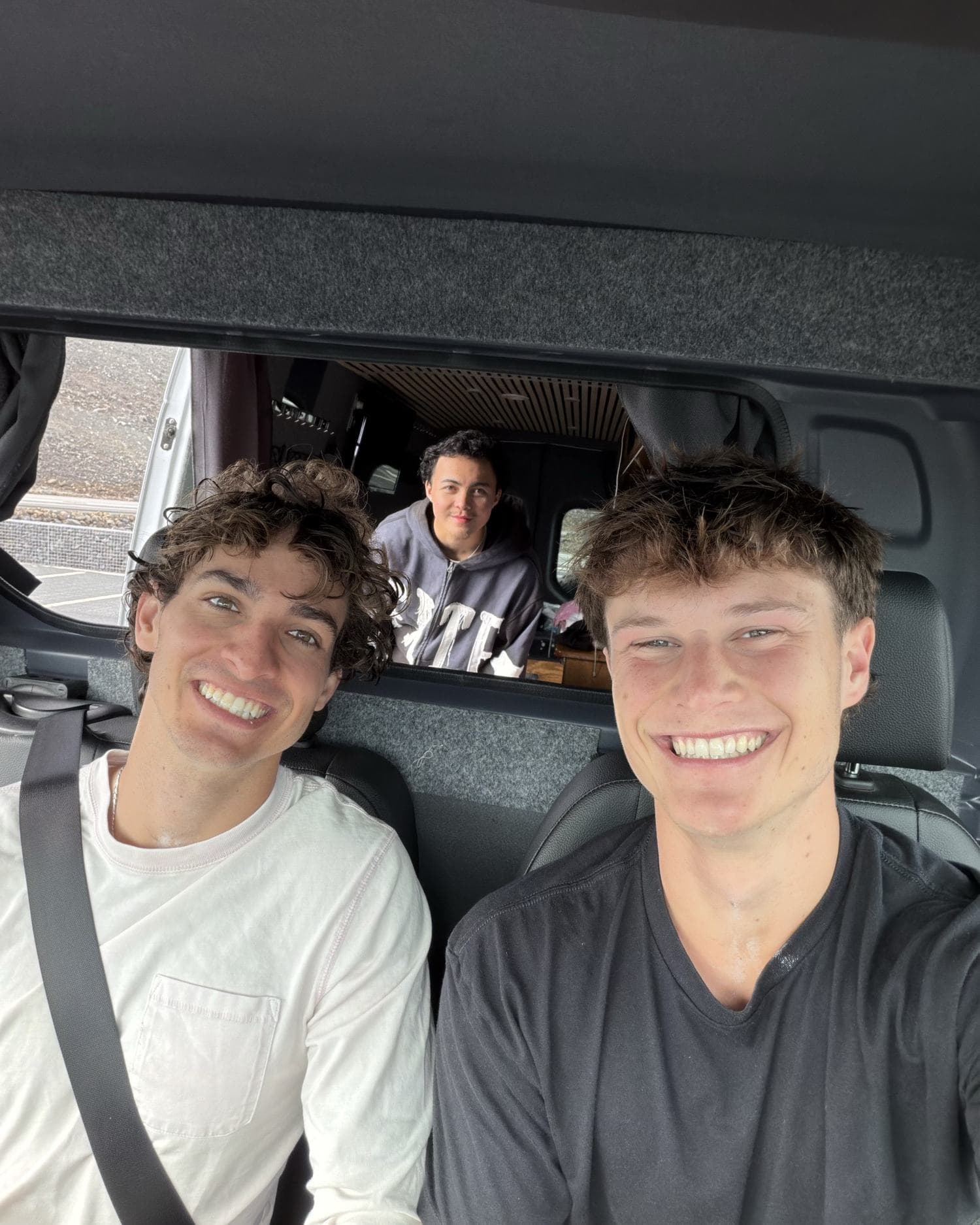 Squeezed into the camper van together, all smiles